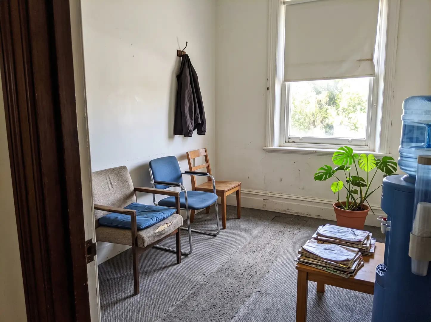 Chairs in a quiet waiting area by a window