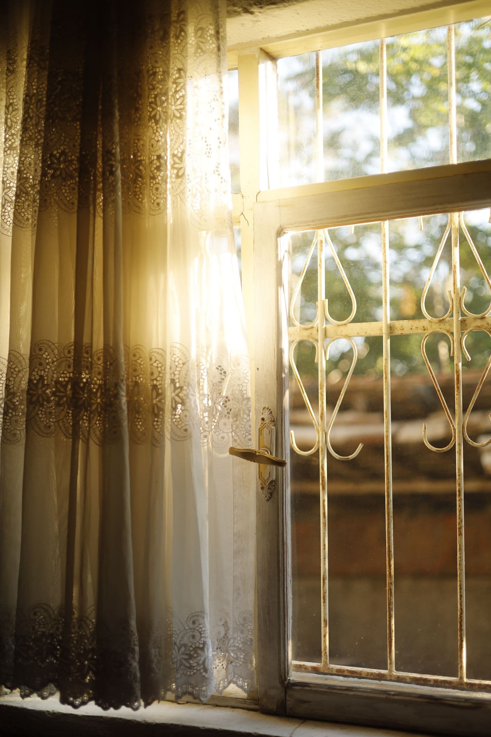 Warm sunlight through a lace curtain in the practice